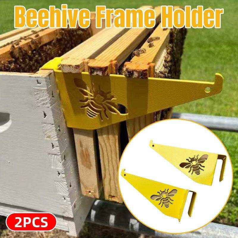 Metal beehive frame holder with yellow finish and bee design
