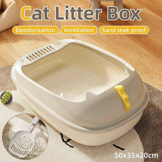 Open beige and yellow cat litter tray with high sides and litter scoop included.