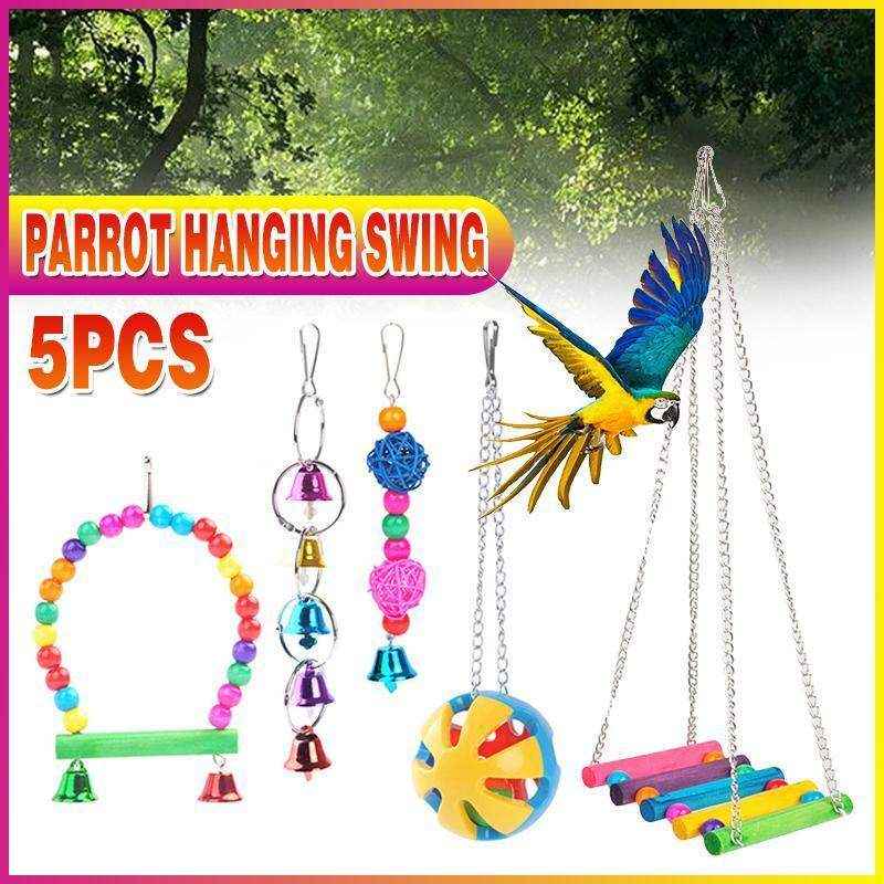 Hanging colourful bird toys in parrot cage
