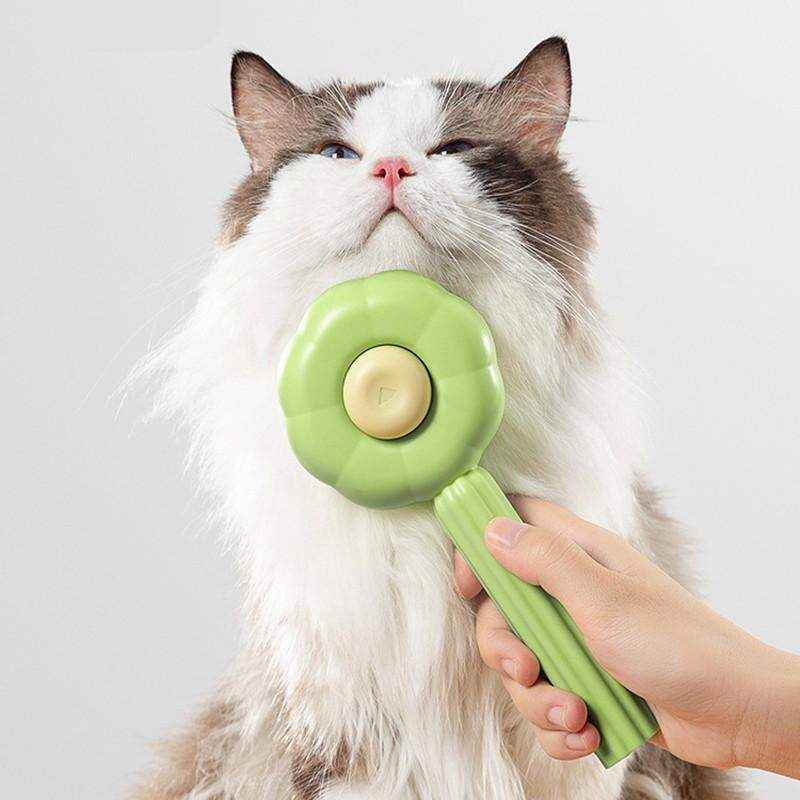 Dual-sided cat deshedding brush used on fabric sofa