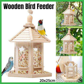 Hexagonal wooden bird feeder hanging in outdoor garden