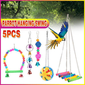 Hanging colourful bird toys in parrot cage
