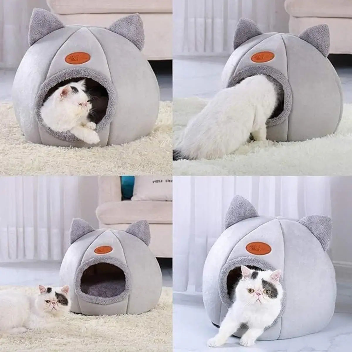 Cats playing and resting in a gray cat-shaped enclosed pet bed with ears